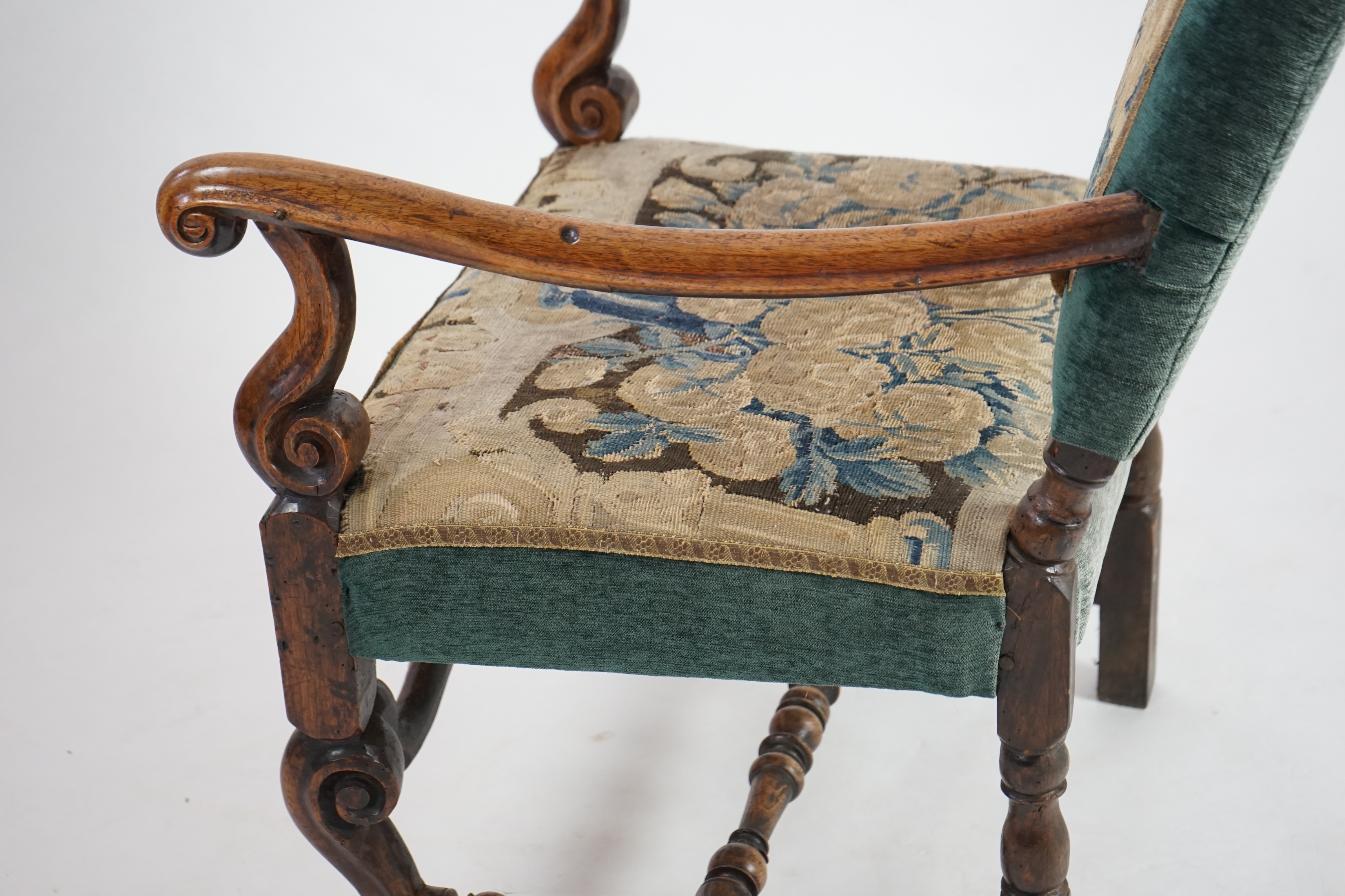 A Louis XV walnut fauteuil tapestry seated armchair